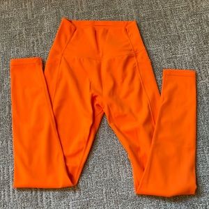 Small orange BuffBunny leggings with pockets